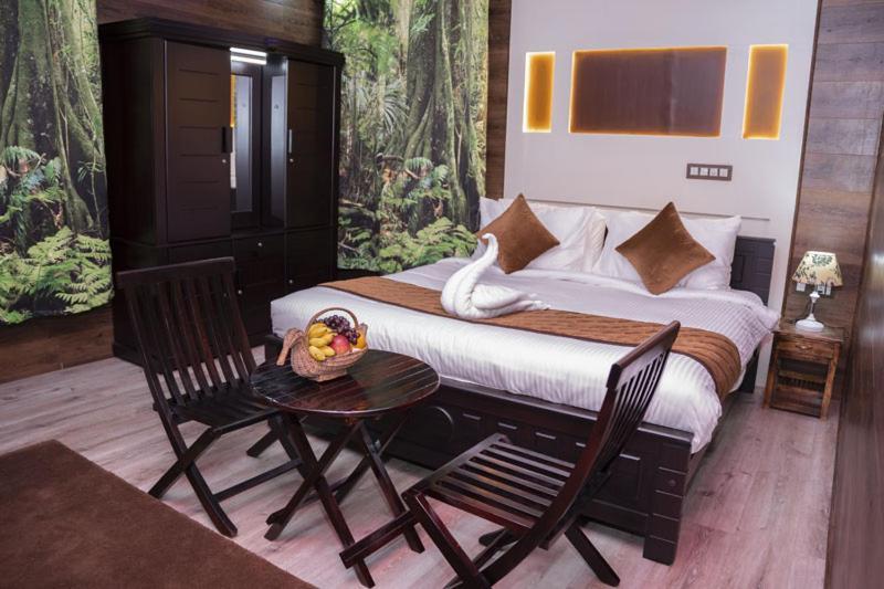 Mango Meadows Hotel กัตตะยัม ภายนอก รูปภาพ